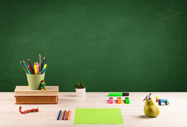 Back to school concepty with clear blackboard background, desk, items