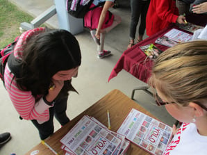 Students signing YOLO Pledges RRW Marathon.jpg