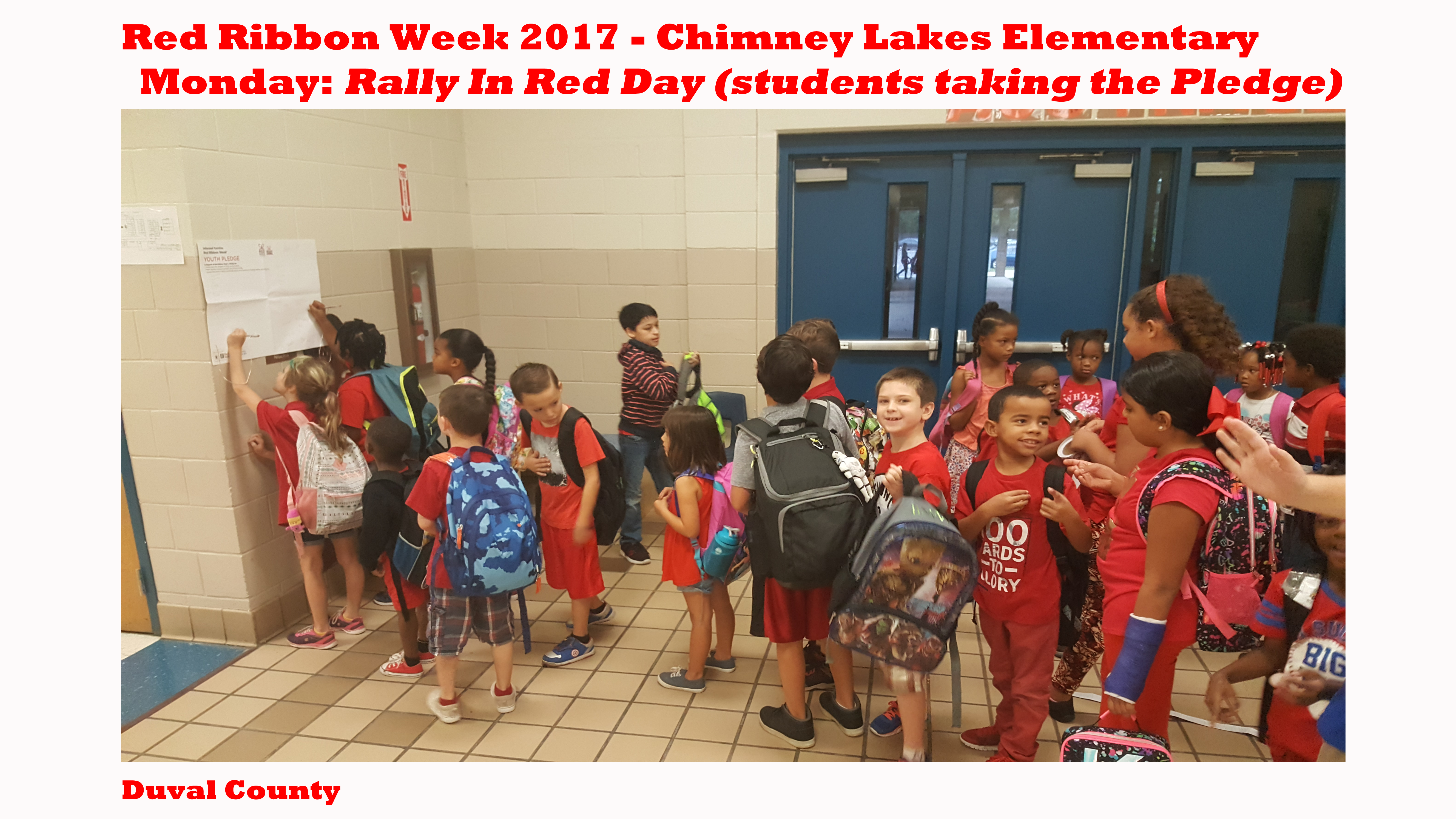 chimney lakes students taking the pledge and wearing red.png